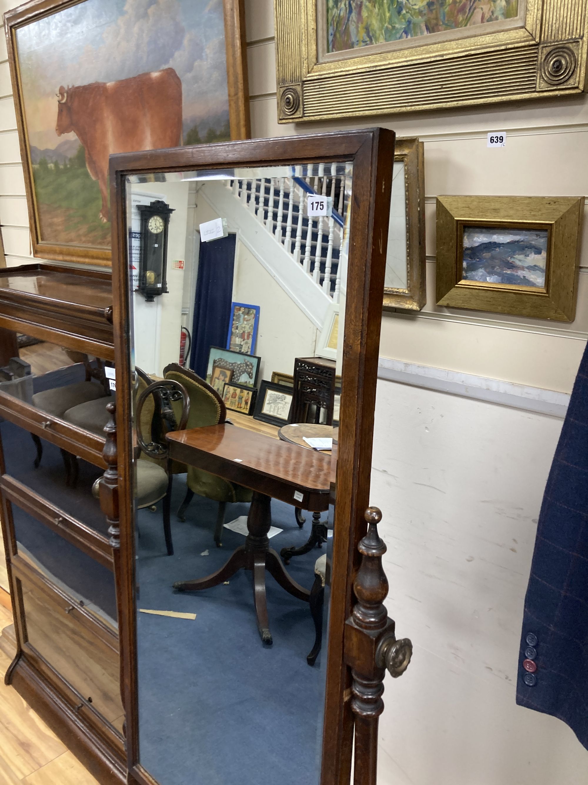 A 1920s oak cheval mirror, width 68cm height 164cm